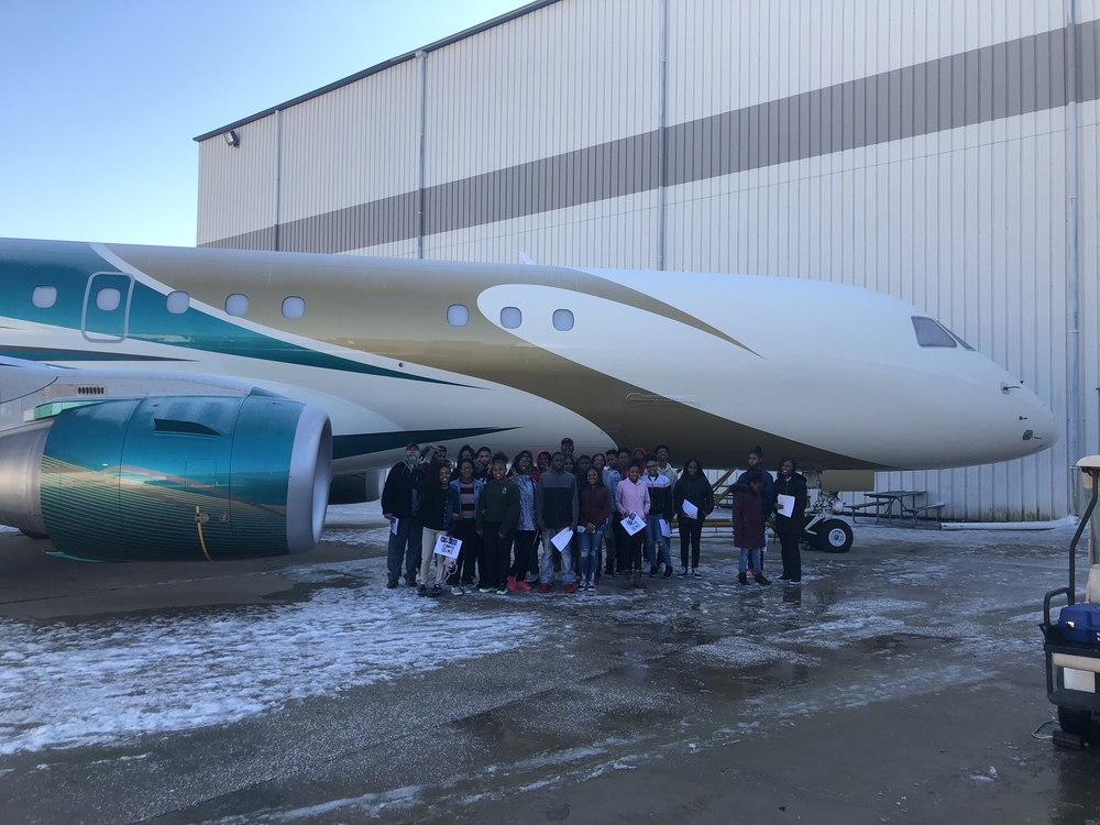 Students tour West Star Aviation maintenance and repair facility.